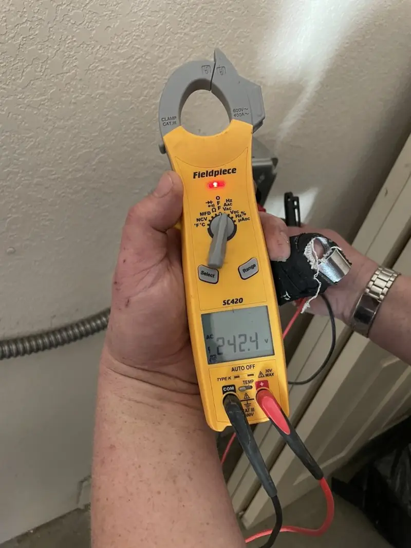 Voltage testing with clamp meter during Whole House Surge Protector in Millersburg